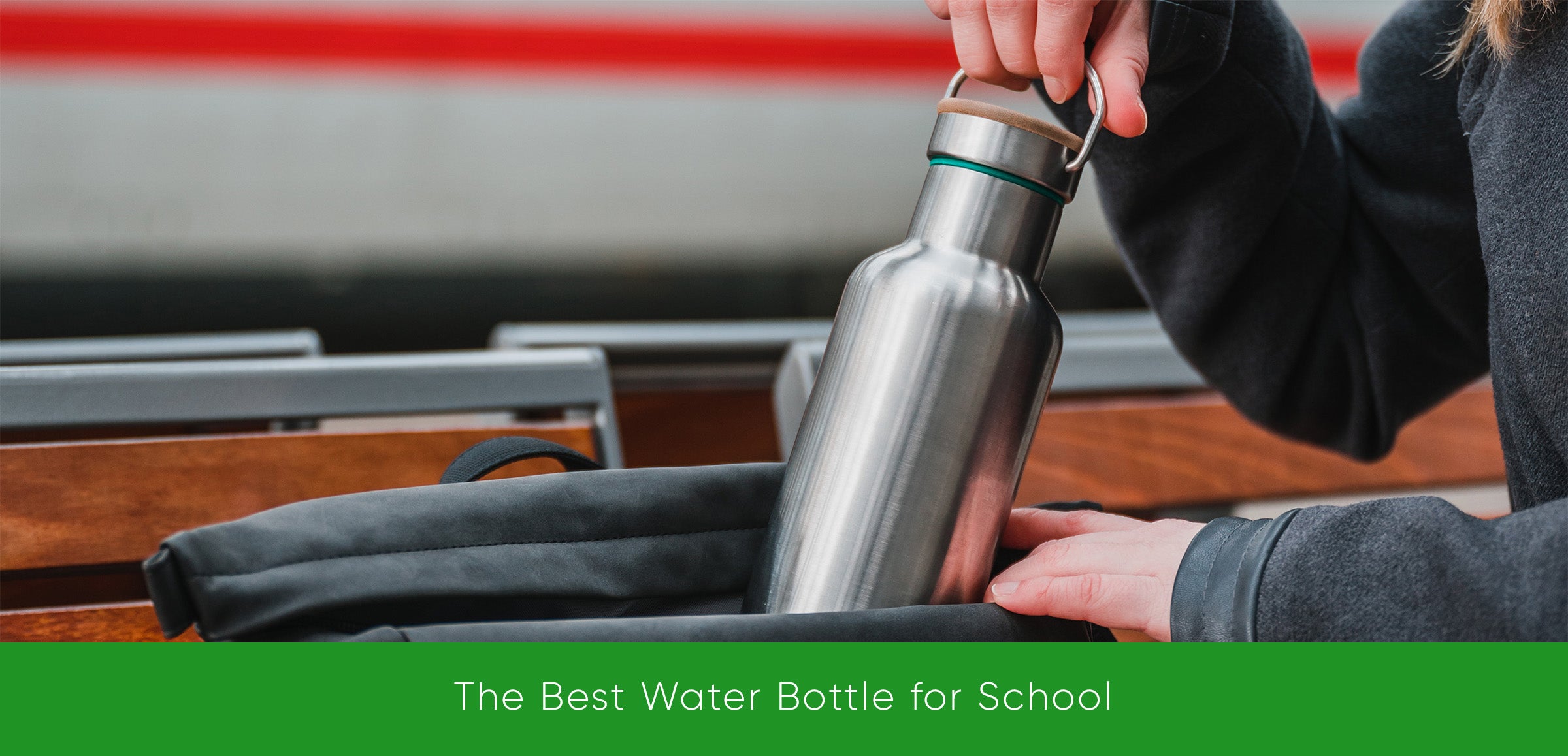 Blockhuette stainless steel water bottle being put into a backpack