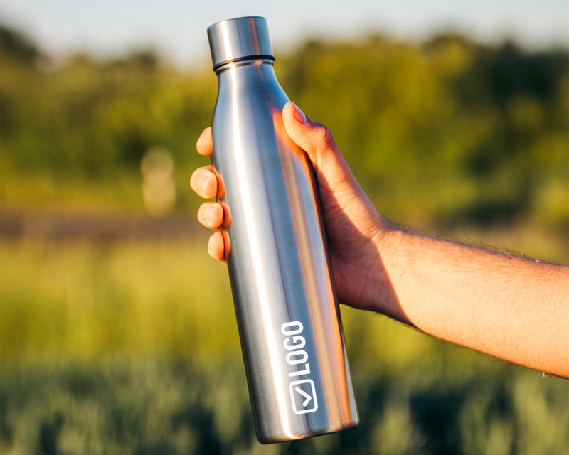 Double vacuum insulated sports bottle with an engraved company logo
