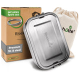 Stainless steel lunch box, 27 oz, closed, in front of its box labeled Includes spare seal and a cotton drawstring bag