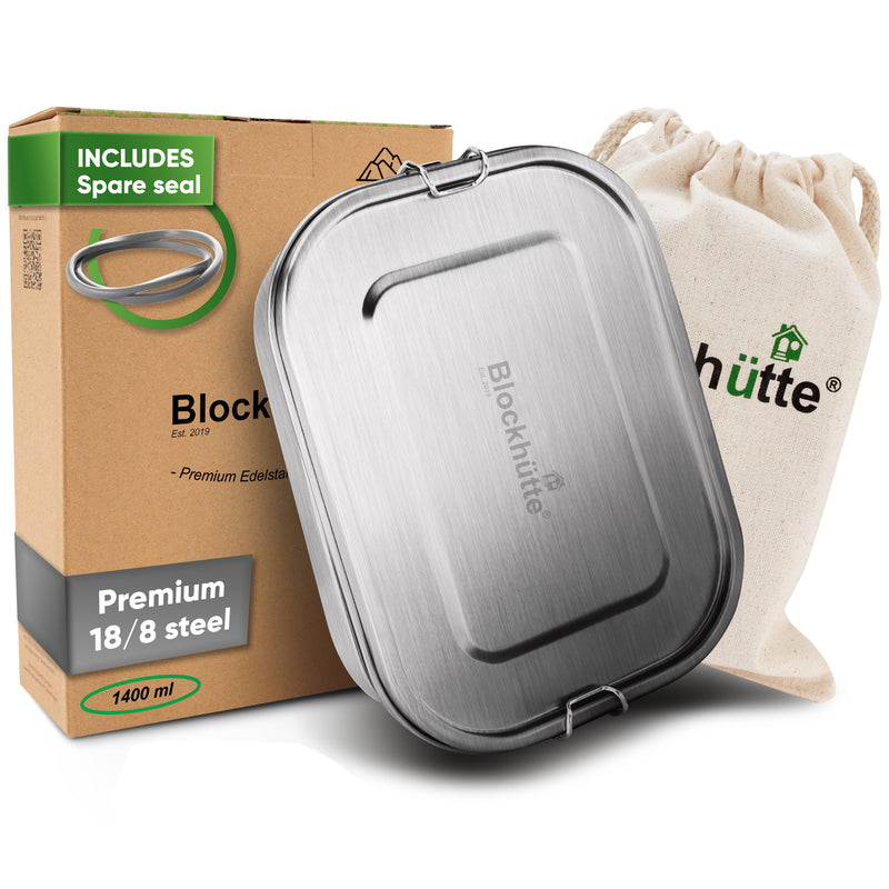Stainless steel lunch box, 47 oz, closed, in front of its box labeled Includes spare seal and a cotton drawstring bag